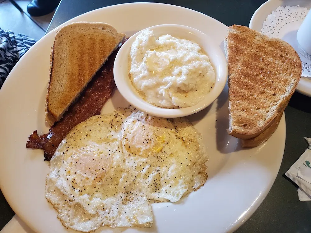 Over Easy Egg Breakfast with Bacon and Grits
